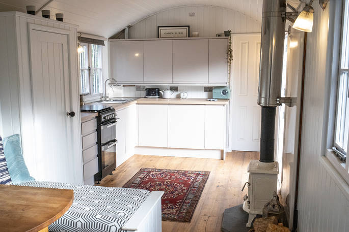 Cook inside the shepherd’s hut using the fully equipped kitchen at Spring Park