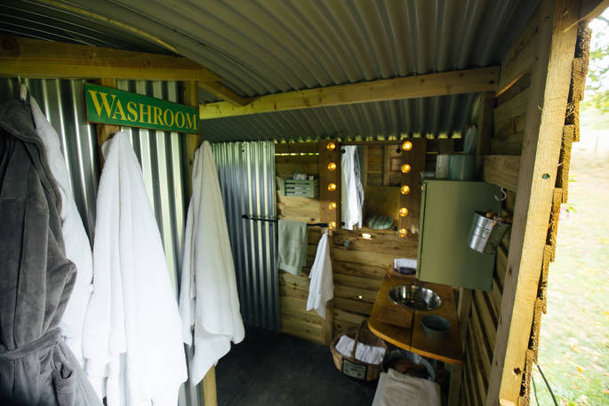 Fluffy robes to keep cosy after you use the incredible outdoor shower amongst the trees at Fairfield, Acorn Farm