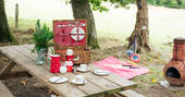 Light the chiminea to keep cosy as you enjoy a delicious picnic outside Fairfield shepherd's hut at Acorn Farm in Devon