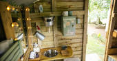 The beautifully rustic washroom at Fairfield shepherd's hut, Acorn Farm in Devon