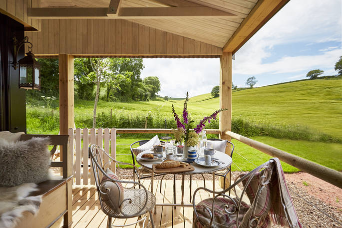 Rolling Devon countryside from Brownscombe Cabin and the outside deck. Pick up some fresh croissants from the onsite honesty shop