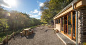 The Linhay barn in the sunshine, at Butterhills Escapes in Devon