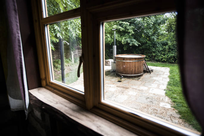 View out from the hobbit hut of your own wood-fired hot tub