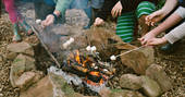 Toast marshmallows over an open fire at Penhein Glamping in Monmouthshire