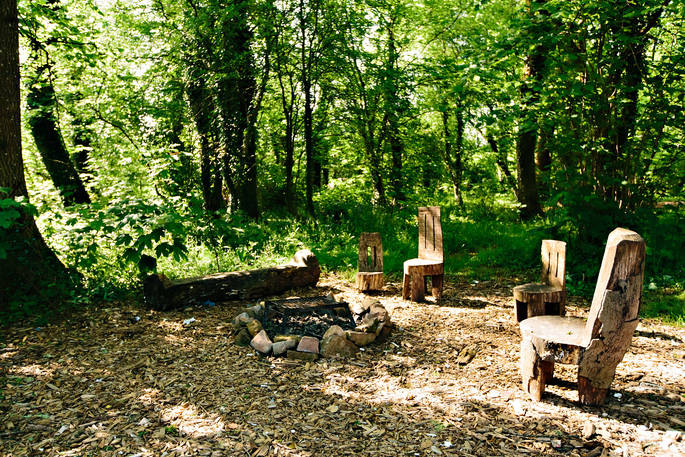 Chairs around the firepit at Penhein Glamping in Monmouthshire
