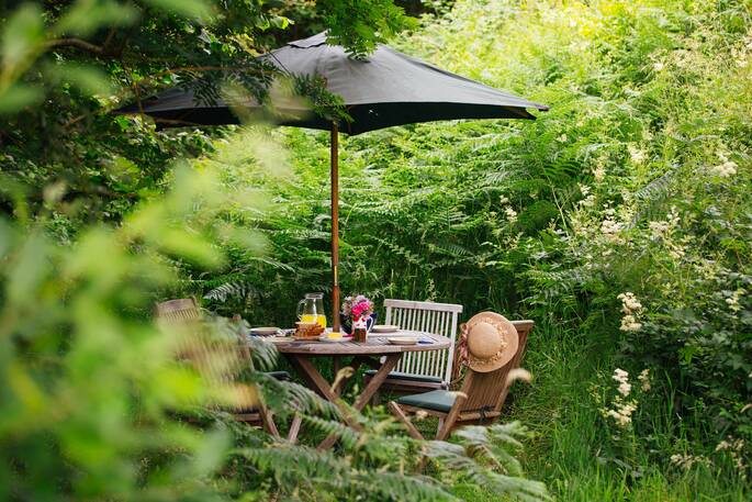 Dine outside come rain or shine and feel surrounded by nature at The Straw Cottage in Powys, Wales