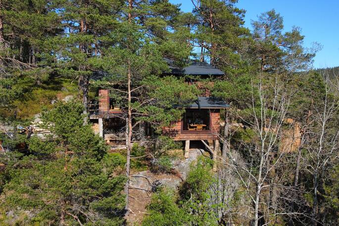 Cliff Cabin hidded in the forest